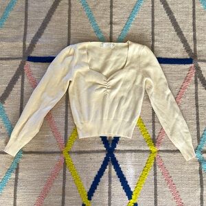 Cream sweater with sweetheart neckline